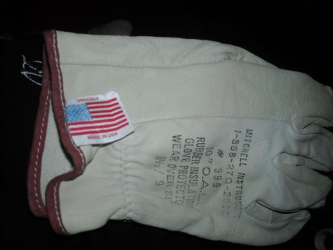 1979 Ford F-150 - Close-up of work gloves, showing a 'Made in USA' label and printed instructions.