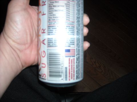 1979 Ford F-150 - A hand holds an energy drink can displaying nutritional facts and a barcode.