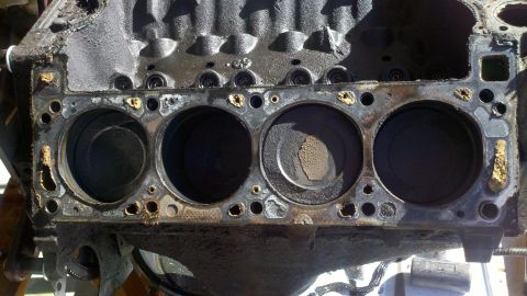1978 Ford Bronco - Close-up view of an engine block's cylinders, indicating a need for motor rebuild.