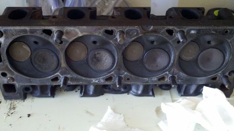 1978 Ford Bronco - This engine cylinder head shows signs of wear and carbon buildup around the valves.