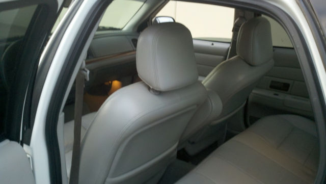 Interior view of the rear seats of a white sedan.