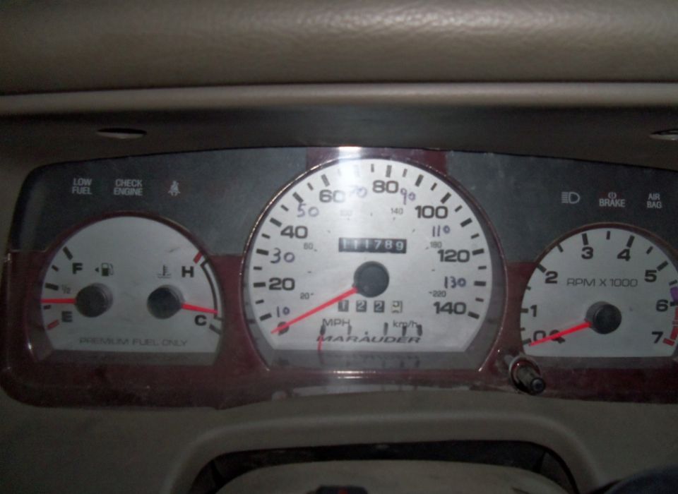 Dashboard gauges with 'Marauder' text on the speedometer, fuel gauge, and tachometer