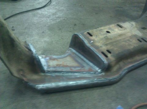 1979 Ford Bronco - Close-up of a custom-welded metal frame component, likely for a vehicle modification.