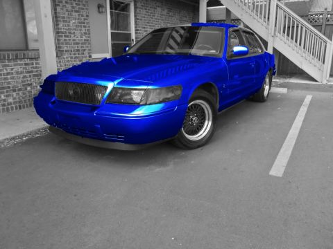 2000 Mercury Grand Marquis - Blue sedan parked in a parking spot.