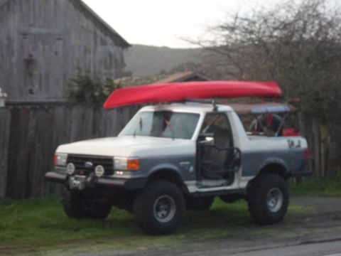 1991 Ford Bronco - This 1991 Ford Bronco is equipped for an outdoor adventure with a canoe on top.