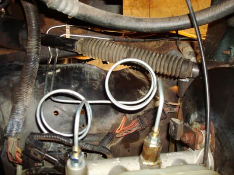 1995 Ford Bronco - Brake lines and master cylinder components are visible in this close-up view.