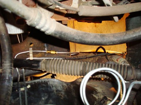 1995 Ford Bronco - This image shows a section of a vehicle's undercarriage, focusing on brake lines and hoses.