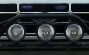 1992 Ford Bronco - Close-up of the front grille and lighting of a 1992 Ford Bronco.