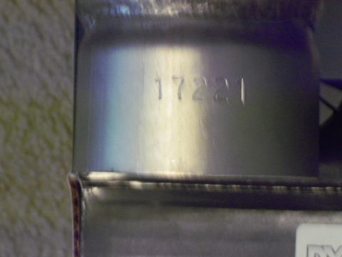 1979 Ford Ranchero - A close-up view shows a stamped part number on a metal component, possibly from a vehicle's cooling system.