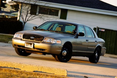 2005 Ford Crown Victoria - This 2005 Ford Crown Victoria is captured in a three-quarter front view, its gray exterior.