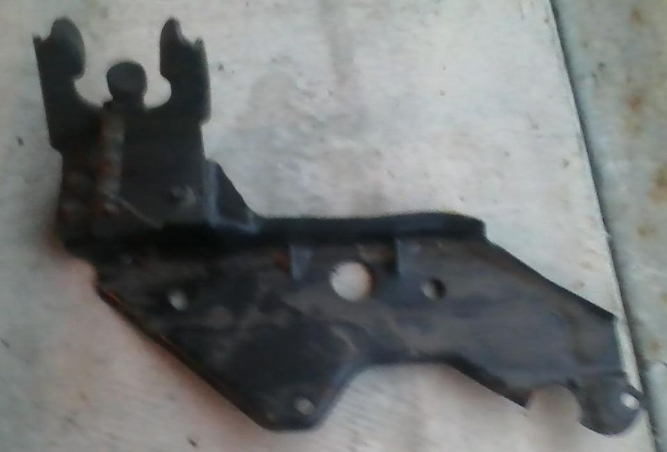 Black metal vehicle bracket with mounting holes