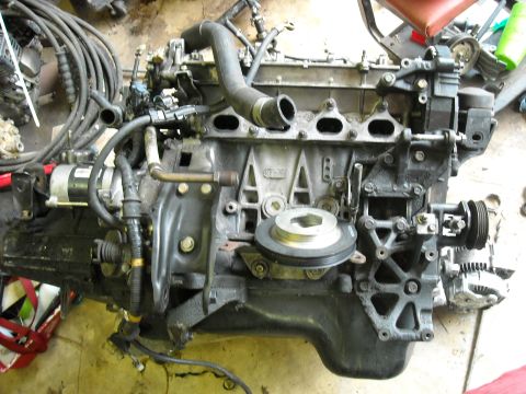 1979 Ford F-150 - Engine block assembly with various components and hoses connected.