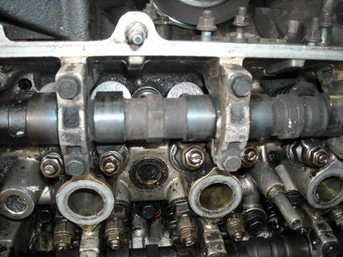 1979 Ford F-150 - Detailed view of the internal workings of an engine, focusing on the camshaft and valve assembly.