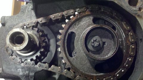 1978 Ford Bronco - Close-up of engine timing chain and gears, indicating a motor rebuild.