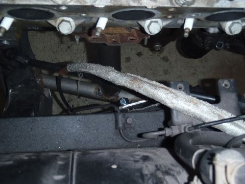 1978 Nissan 300ZX - Engine block detail with exhaust pipe and spark plugs visible, Supermotors.net logo in corner.