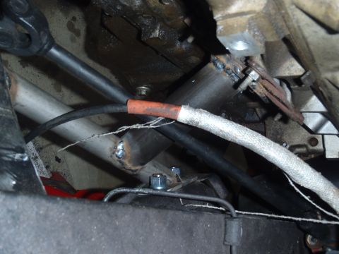1978 Nissan 300ZX - Custom exhaust pipes and driveshaft components are visible from underneath the vehicle.
