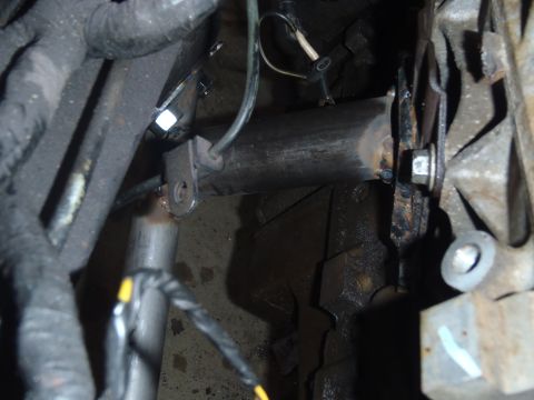 1978 Nissan 300ZX - Detail view of engine and exhaust parts, with visible wiring and metal brackets.