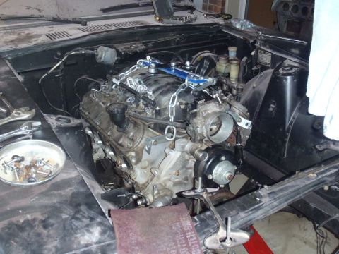 1978 Nissan 300ZX - Engine swap underway, showing the new engine being lowered into the vehicle's engine bay.