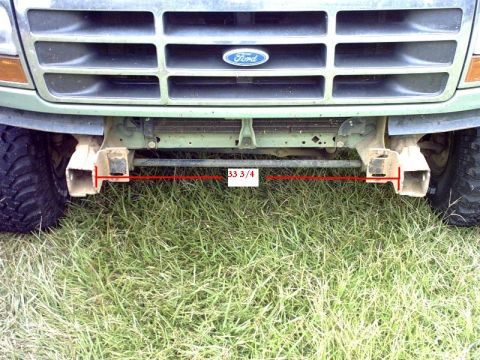 1995 Ford Bronco - Front view of a Ford truck, showing the grille and a measurement of the bumper width.