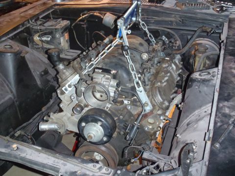 1978 Nissan 300ZX - Engine installation in progress, showing the engine being carefully maneuvered into place.