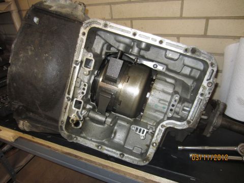 1979 Ford Bronco - An automatic transmission is shown disassembled, revealing its internal components and torque converter.