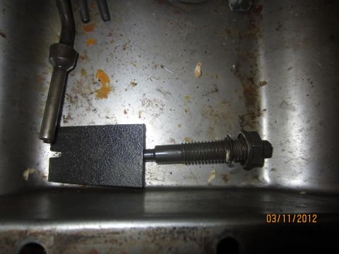 1979 Ford Bronco - Close-up of a transmission component, possibly for a 1979 Ford Bronco, showing a threaded rod and spring mechanism.
