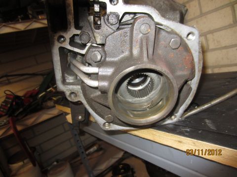 1979 Ford Bronco - A close-up view of a transmission part, showing internal splines and metal housing.
