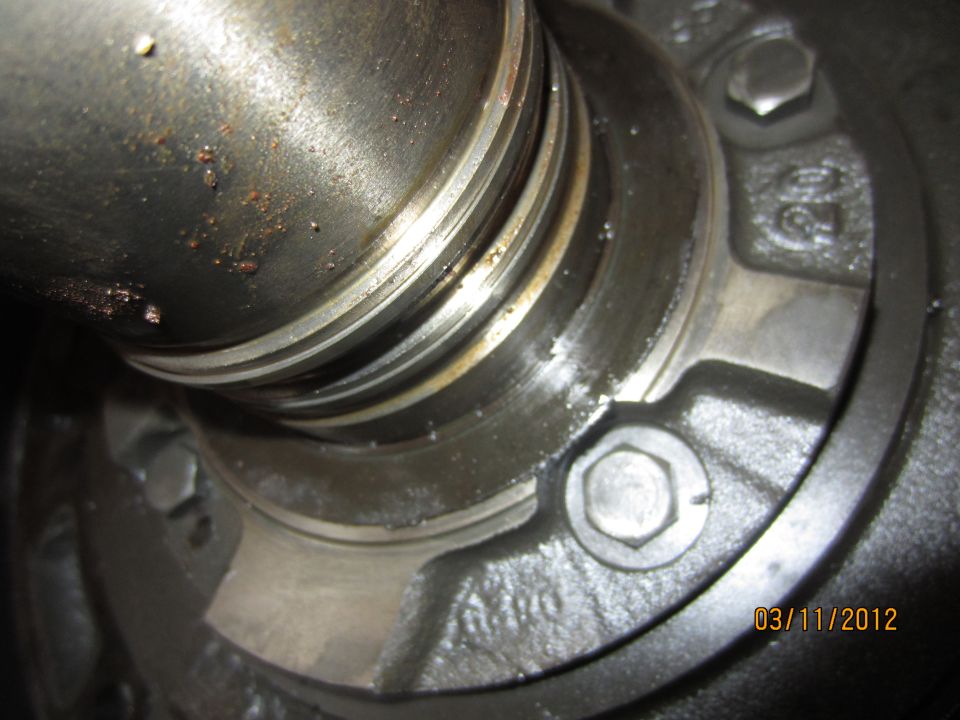 Close-up of a metal part with date stamp 03/11/2012