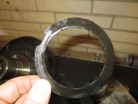 1979 Ford Bronco - Close-up of a damaged metal ring, likely a component from a transmission rebuild.