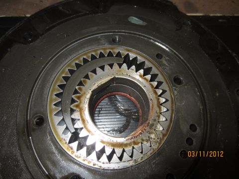 1979 Ford Bronco - A close-up view of a transmission component, revealing intricate gear teeth and signs of use.