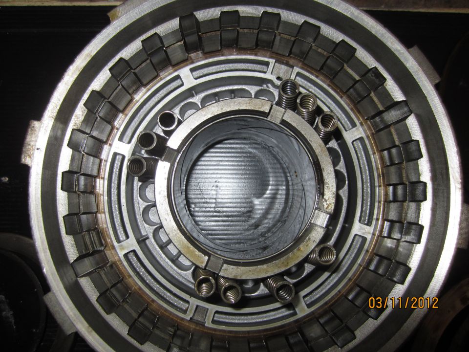 Close-up of an automatic transmission clutch pack with springs and friction plates