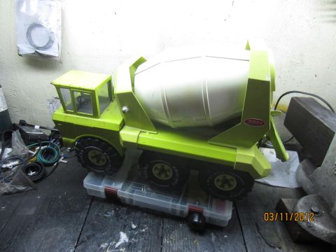 1979 Ford Bronco - Toy cement mixer truck sits on a toolbox in a workshop.