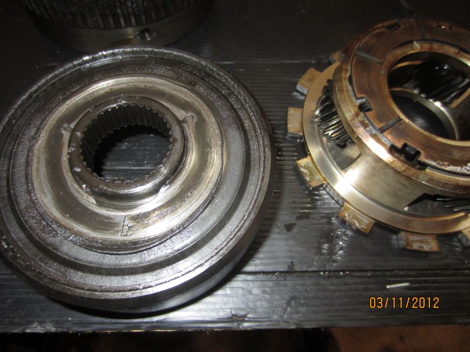 Transmission clutch pack and input shaft splines on a dark surface