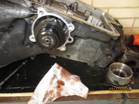 1979 Ford Bronco - Close-up of a disassembled transmission part, with a date stamp of 03/11/2012 visible.