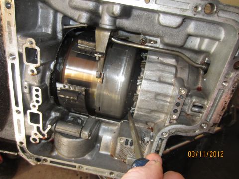 1979 Ford Bronco - Close-up view of a transmission's torque converter and planetary gear set during a rebuild.