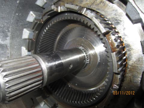1979 Ford Bronco - Close-up view of a transmission's internal planetary gear set and splined shaft.