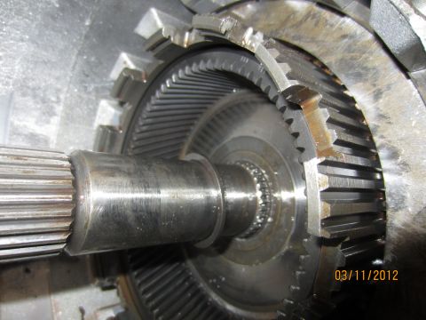 1979 Ford Bronco - A close-up view of internal transmission components, showing gears and a splined shaft.