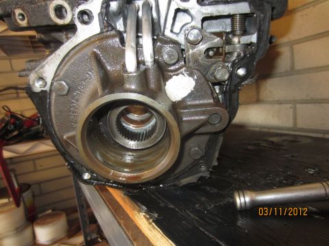 1979 Ford Bronco - A close-up view of a transmission part, showing the splined input shaft and surrounding housing.