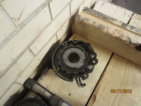 1979 Ford Bronco - A transmission component and splined shaft are shown resting on a wooden surface, with a date stamp of 03/11/2012.