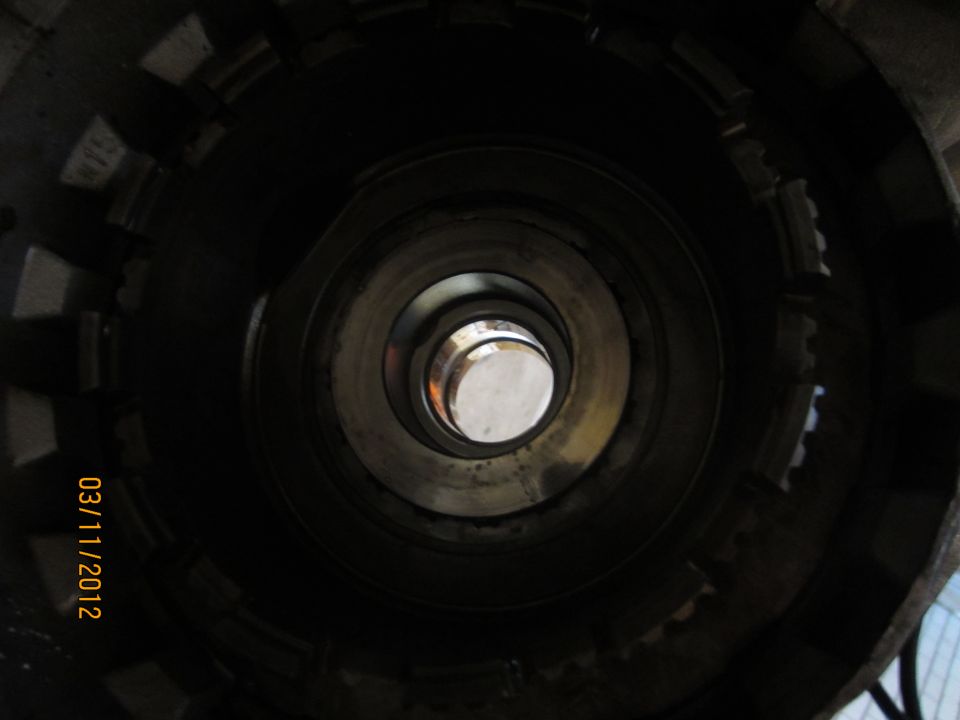 Inside view of a transmission torque converter with a central shaft visible