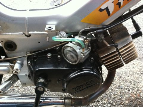 1999 Tomos Targa - Detail of a Tomos moped engine, showing the carburetor and part of the frame.