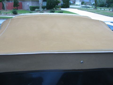 1992 Ford Bronco - A tan soft top is installed on a vehicle, with a watermark at the bottom right.