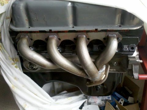 1996 Ford Bronco - Close-up view of an engine block newly installed custom exhaust headers.
