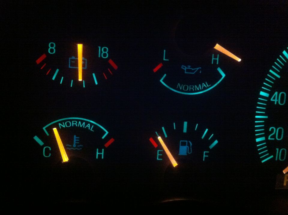 dashboard gauges showing battery, oil, temp, and fuel levels