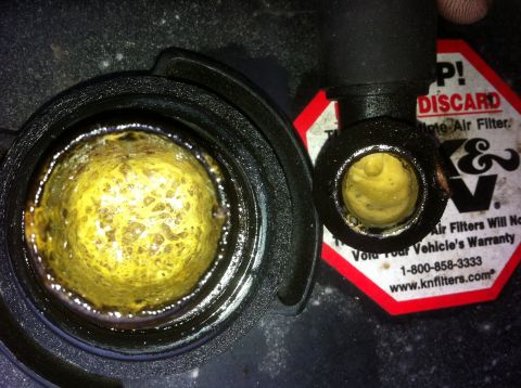 1990 Ford Bronco - Engine components show significant yellow sludge buildup, indicating potential issues. A K&N filter warning is also visible in the backgrou…