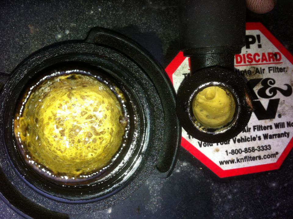 Yellow sludge in engine oil cap and coolant reservoir; K&N filter warning visible