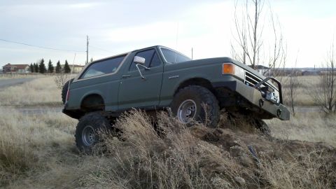 1989 Ford Bronco - This 1989 Ford Bronco is shown navigating a challenging off-road course.