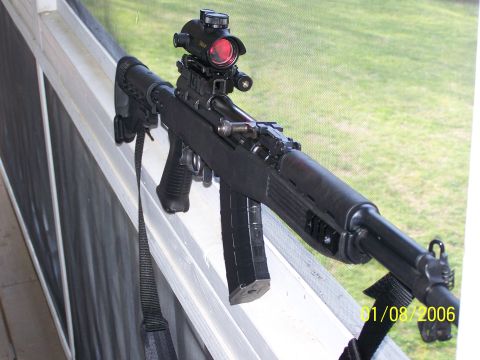 1989 Ford Bronco - A Chinese Paratrooper SKS rifle, equipped with an aftermarket stock and red dot optic, rests on a window sill.