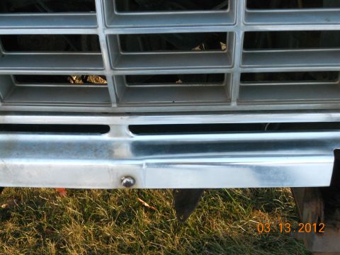 1978 Ford Bronco - Close-up of the front grille and bumper of a 1978 Ford Bronco.