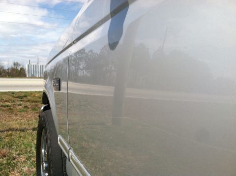 1993 Ford Bronco - Side view of a silver 1993 Ford Bronco, showing the '5.0' badge on the door.
